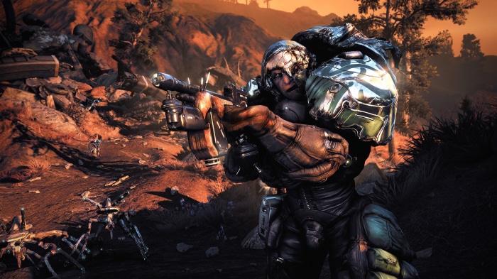 Warframe character with rifle in rocky landscape 4K