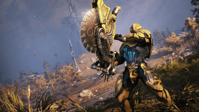 Warframe character with large weapon in landscape 4K