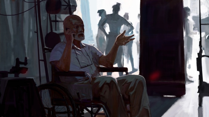Elderly man in wheelchair on phone