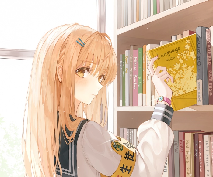 Girl reaching for a book on a shelf