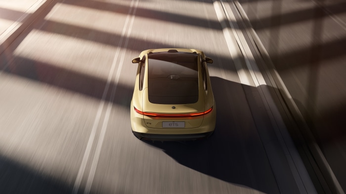 NIO ET5 electric sedan driving on a road