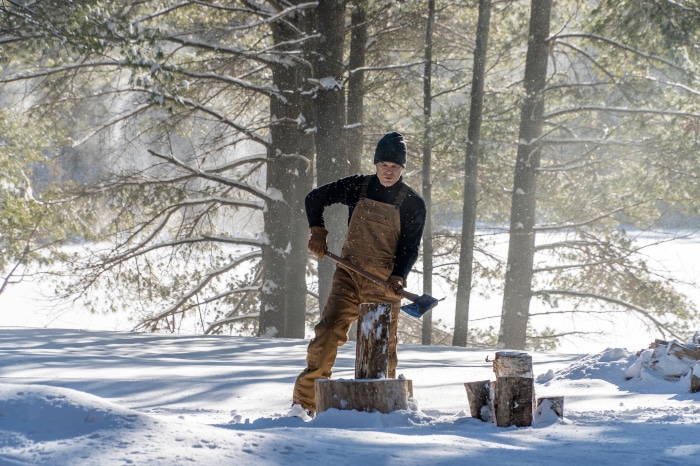 Dexter Morgan from Dexter: New Blood chopping wood in snow