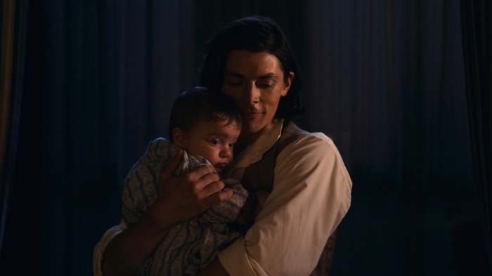 Emily Dickinson holding a baby