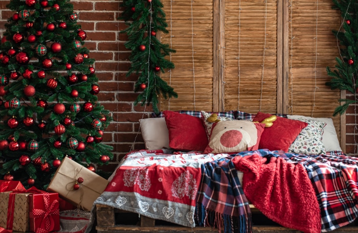 Christmas decorated bed with gifts and tree