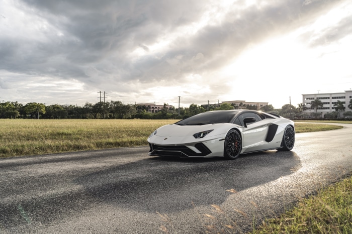 White Lamborghini Aventador S Supercar on a Wet Road