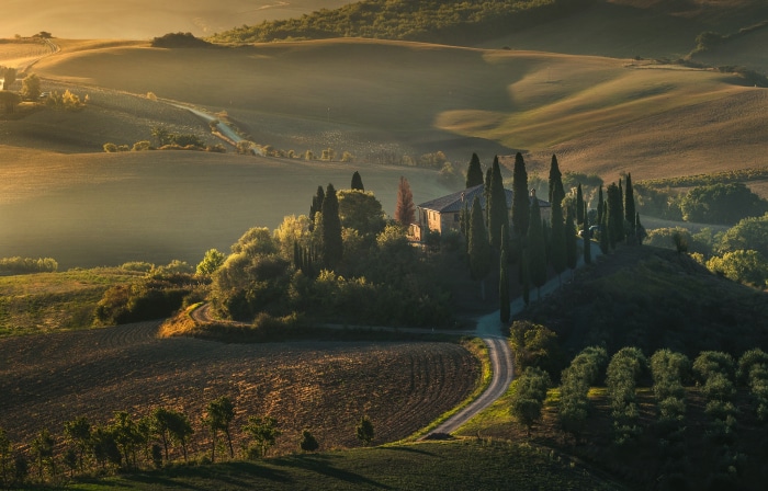 Tuscan landscape with cypress trees and villa