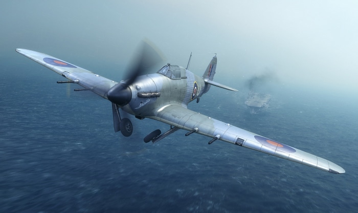 Hawker Hurricane flying over the ocean near an aircraft carrier