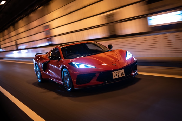Red Chevrolet Corvette Stingray driving in tunnel