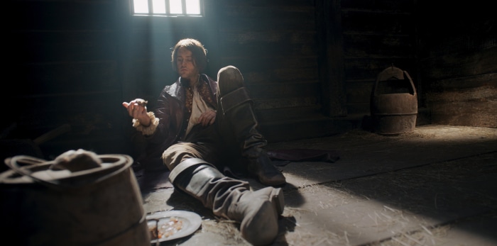 Jaskier from The Witcher in a barn