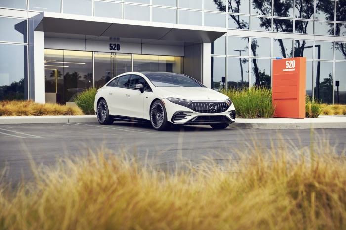 White Mercedes-AMG EQS 53 4MATIC parked in front of building 520