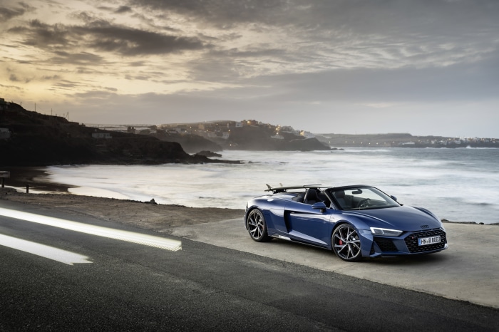 Blue Audi R8 V10 Cabriolet by the ocean