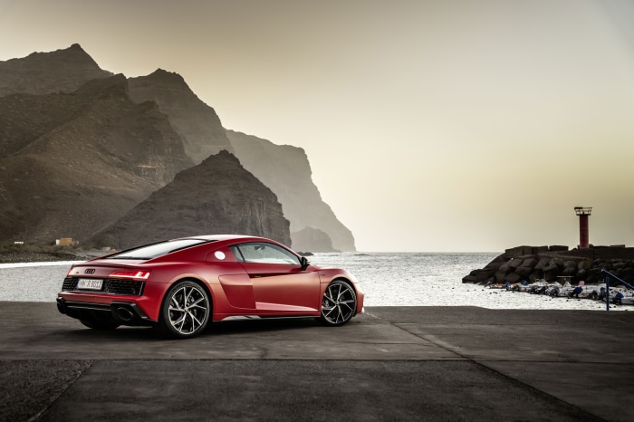 Red Audi R8 V10 parked by the sea