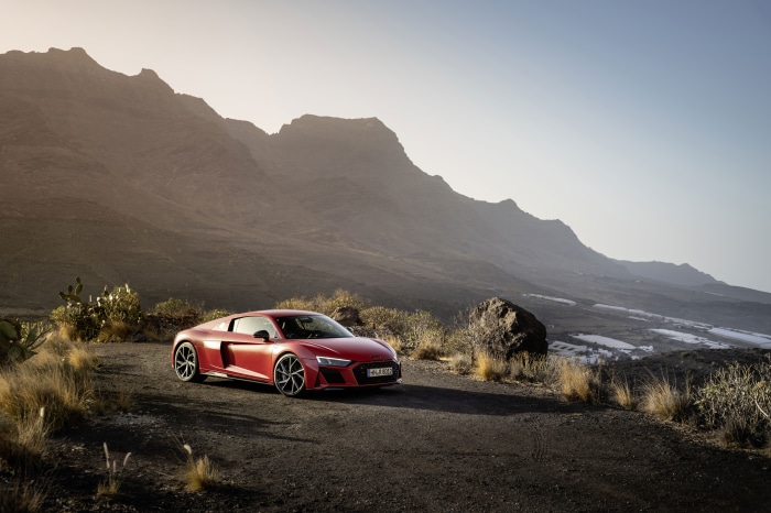 Red Audi R8 V10 parked on a mountain road