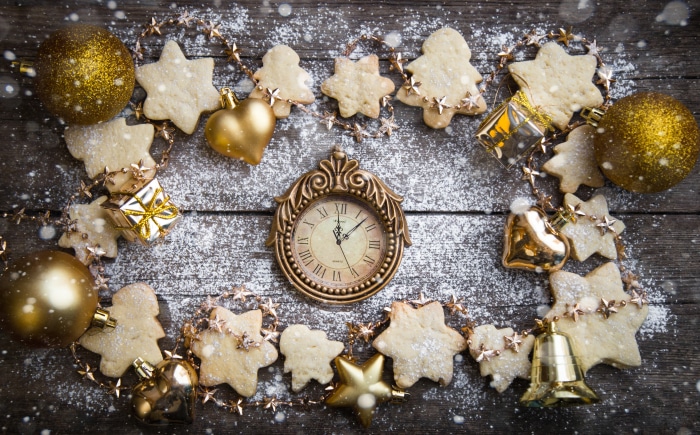 Christmas cookies and decorations with clock