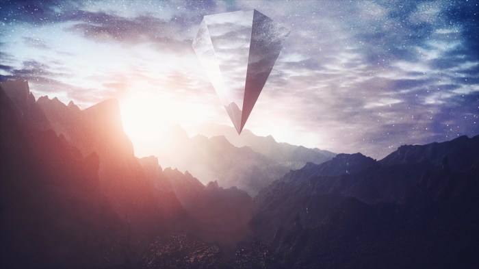 Crystal floating above mountains at sunrise