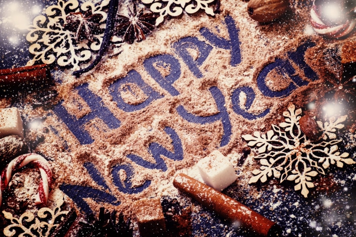 Happy New Year written in cocoa powder