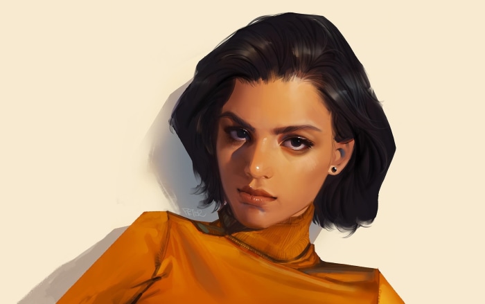 Woman with short dark hair wearing an orange turtleneck