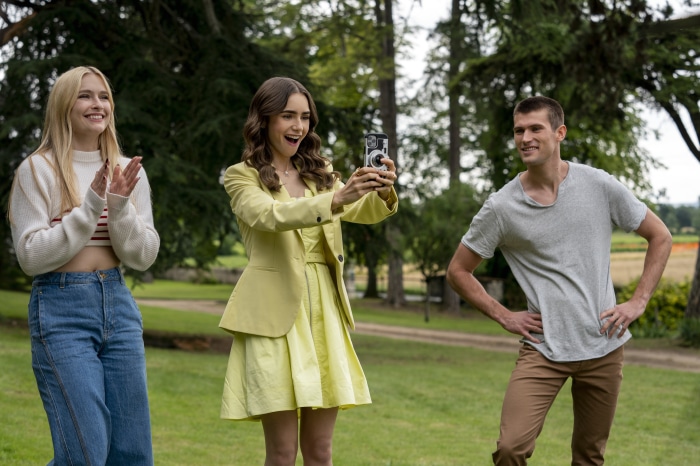 Emily in Paris: Lily Collins with friends outdoors