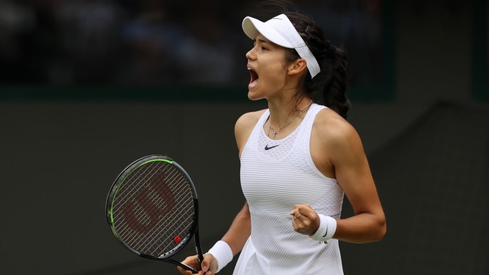 Emma Raducanu playing tennis at Wimbledon