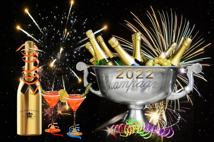 Champagne bottles and cocktails for New Year 2022