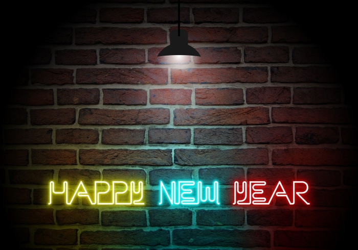 Happy New Year Neon Sign on Brick Wall