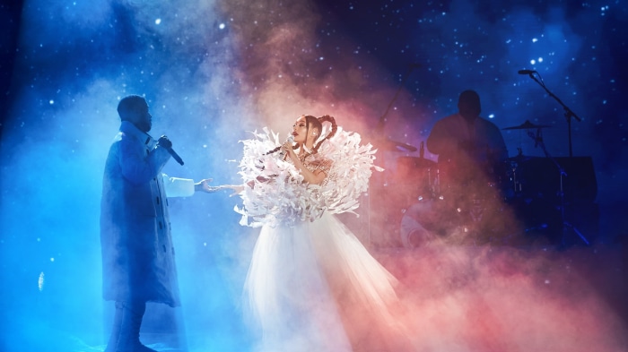 Ariana Grande and Kid Cudi performing