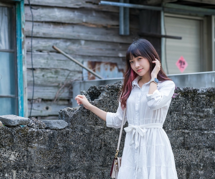 Asian woman in white dress
