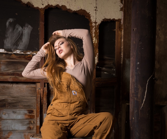 Redhead woman in Carhartt overalls