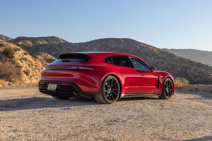 Red 2022 Porsche Taycan GTS Sport Turismo on dirt road