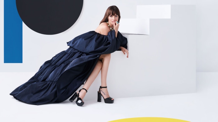 Dakota Johnson in a navy blue dress
