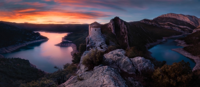 La Pertusa castle overlooking a reservoir at sunset, Spain