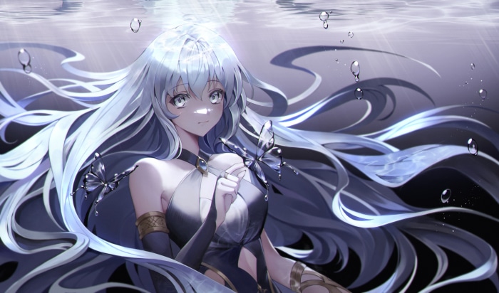Girl underwater with butterflies and bubbles