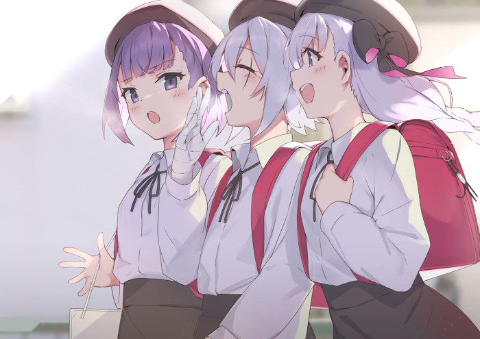 Three girls in school uniforms with backpacks
