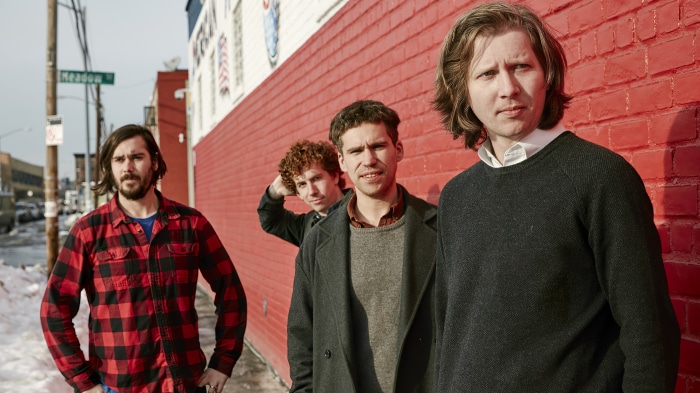 Parquet Courts band members standing outside