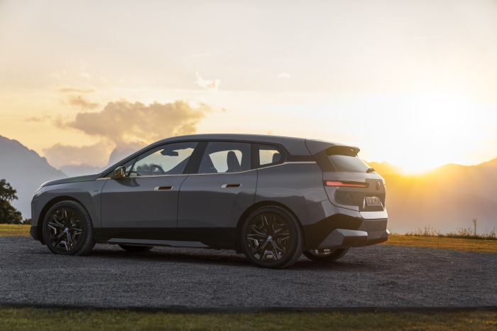 BMW iX M60 electric SUV at sunset