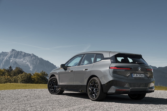 BMW iX M60 electric SUV in mountains