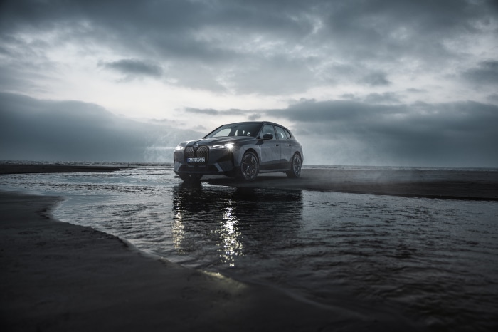BMW iX M60 Electric SUV on a Beach