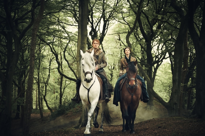 Jamie Fraser and Claire Fraser from Outlander on horses