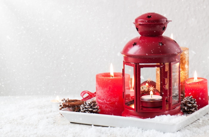 Christmas lantern with candles and pine cones