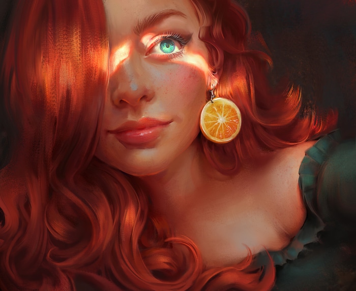 Woman with red hair and orange earring