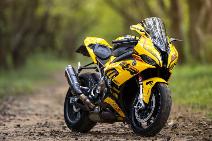 Yellow BMW S1000RR Sport Motorcycle on Dirt Path