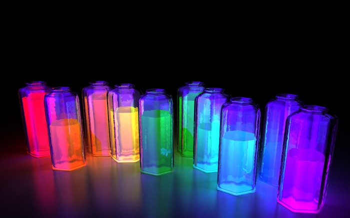 Jars with colorful glowing liquids