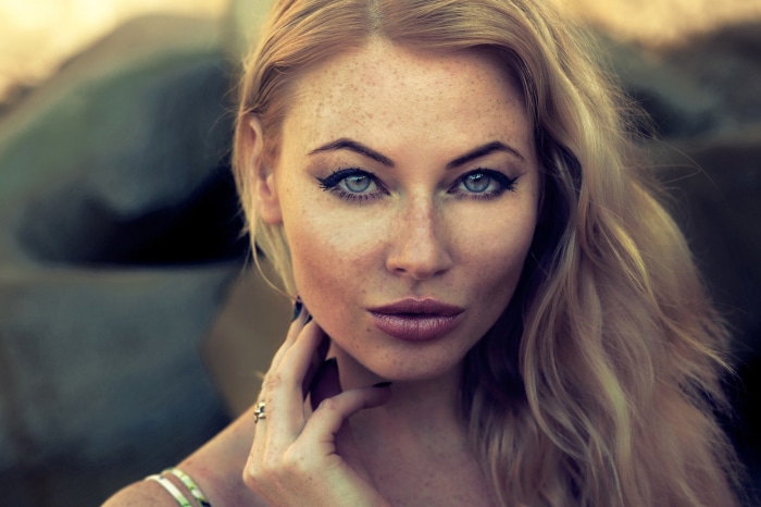 Woman with freckles and blue eyes