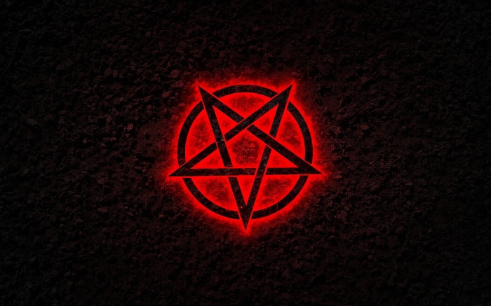 Red Pentagram on Dark Textured Background
