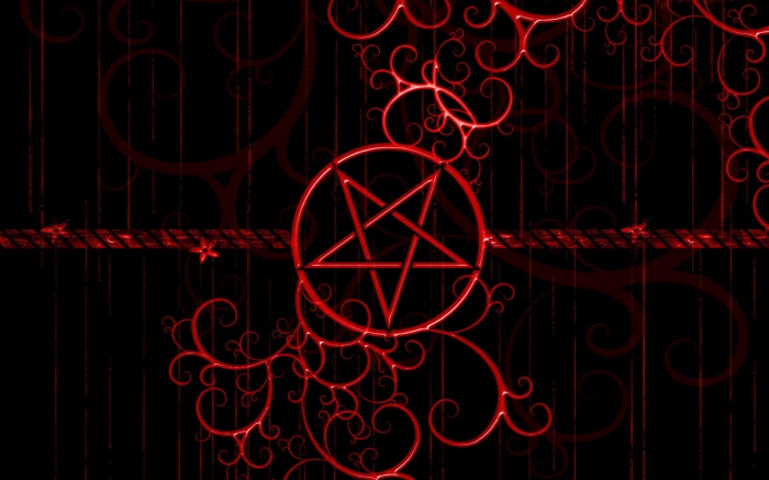 Red Pentagram Symbol with Swirling Ornaments on Black Background