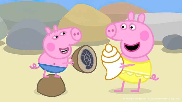 Peppa Pig characters on a beach with shells