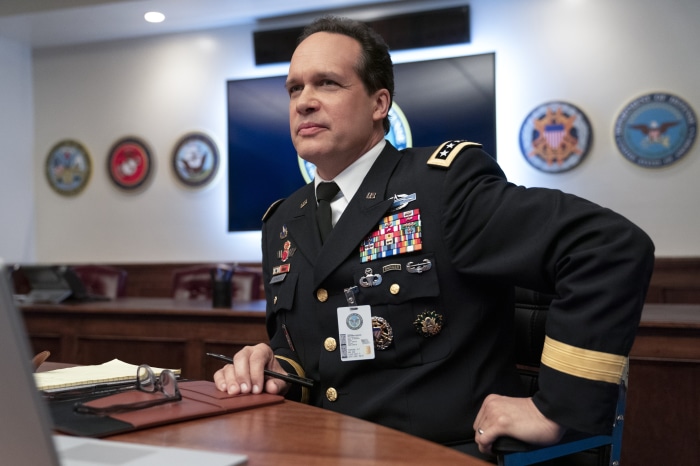 General in military uniform in office