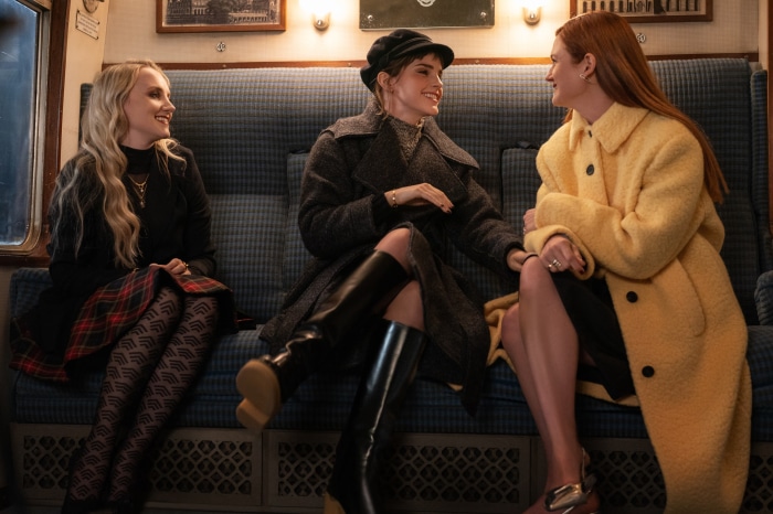Bonnie Wright, Evanna Lynch, and Emma Watson on a train