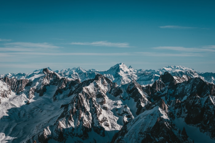 Snow-covered mountains under a clear blue sky