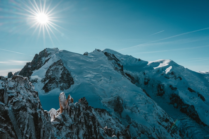 Snowy mountains under a bright sun